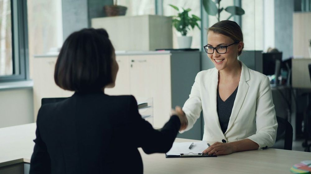 Job interview handshake in an office