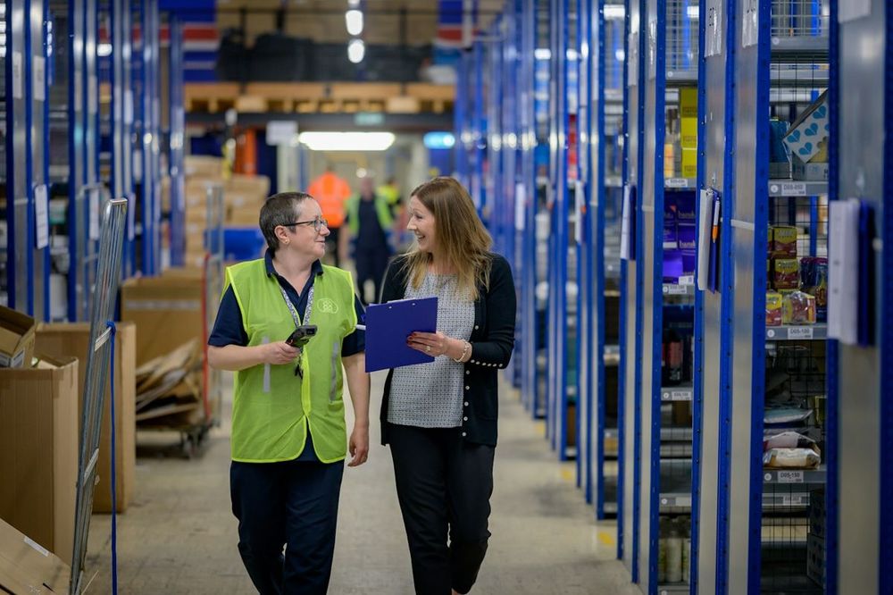 Warehouse staff checking stock on a tablet